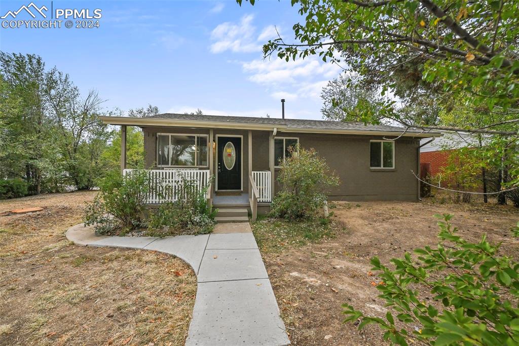 A large lot accompanies this home. An oversized detached garage has an entrance off the corner.