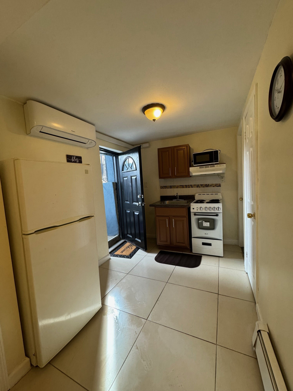 a kitchen with stainless steel appliances a refrigerator and a stove top oven