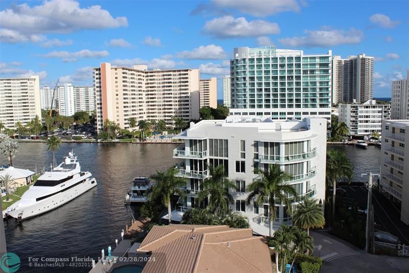 a view of a lake with tall buildings