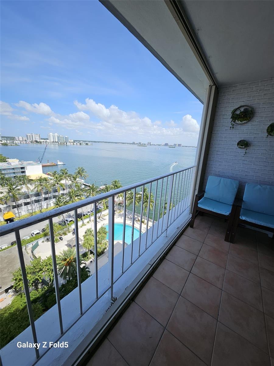 a view of balcony with furniture