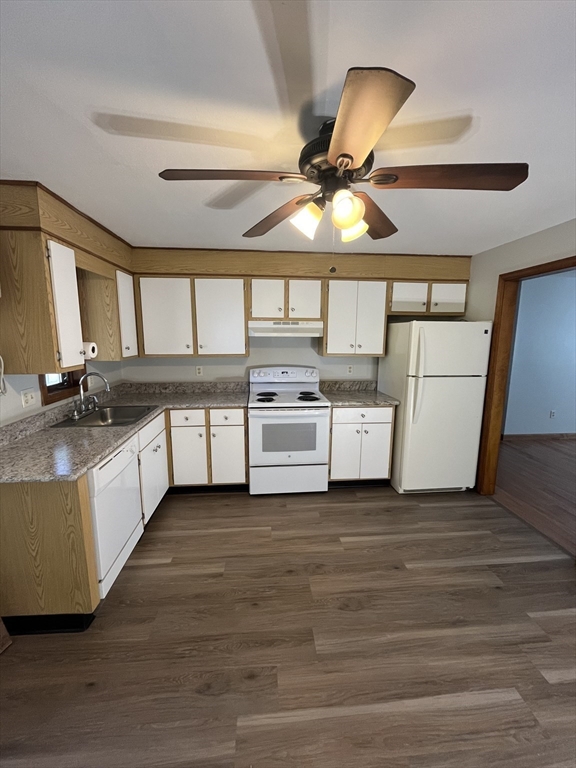 a kitchen with a sink cabinets and window