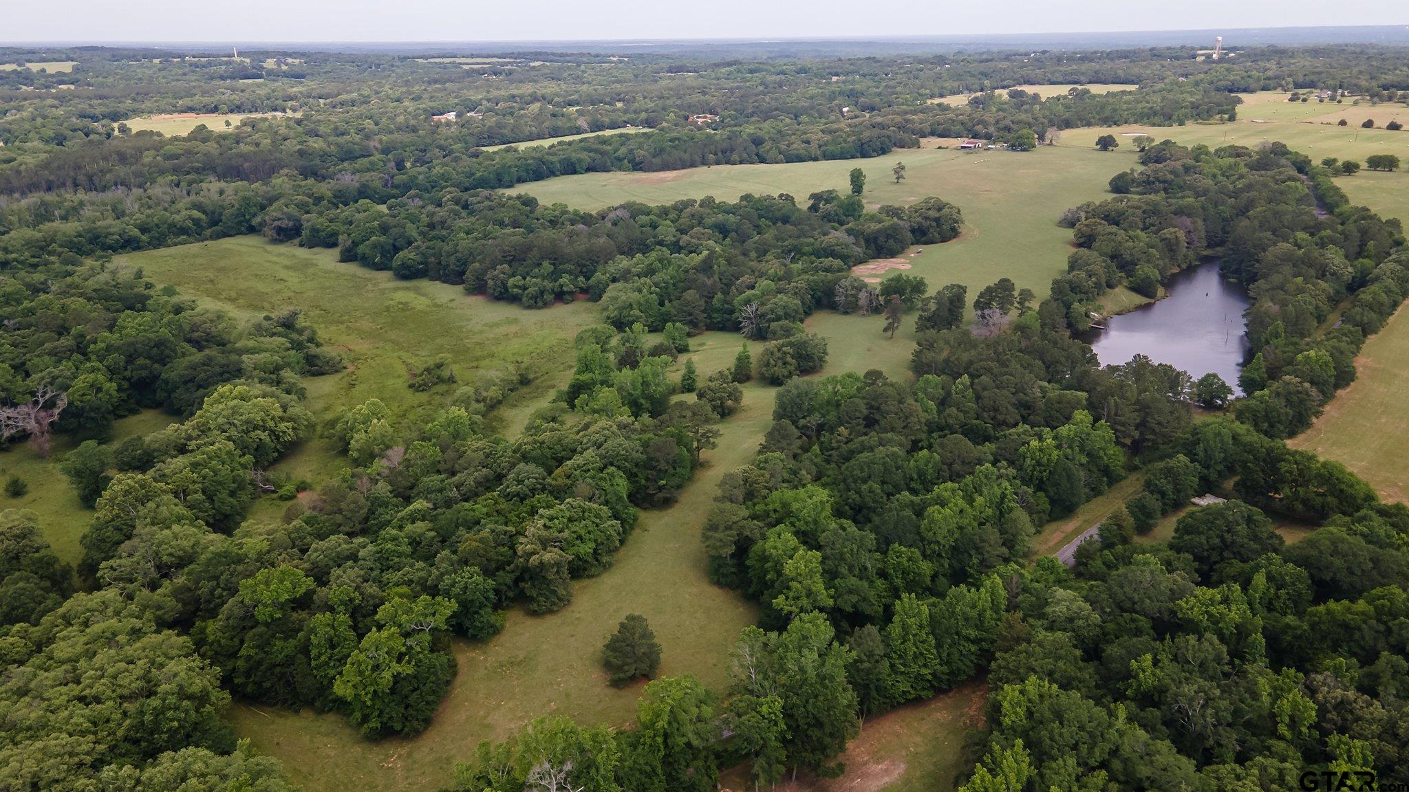 an aerial view of lake residential house and outdoor space