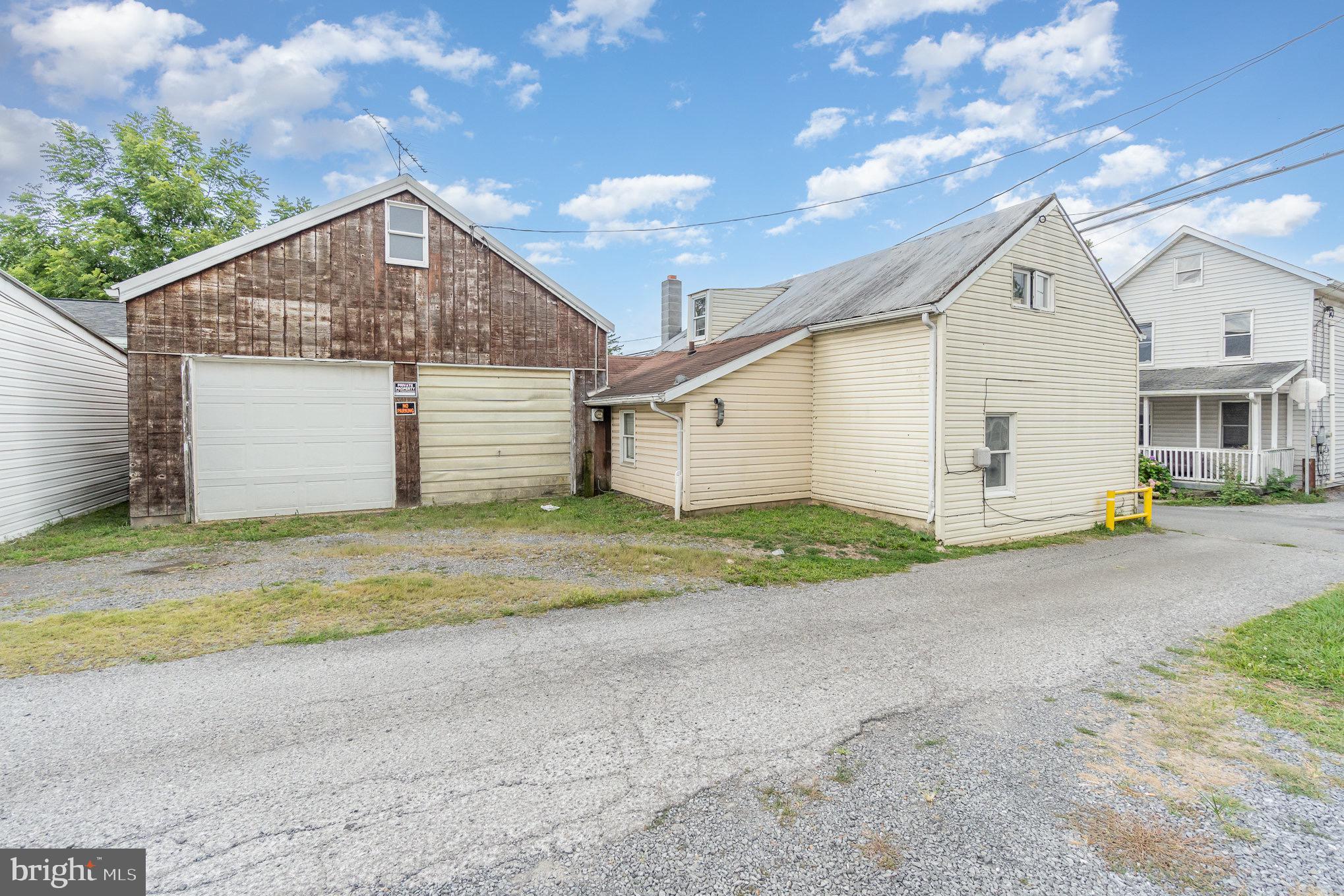 a view of garage and yard