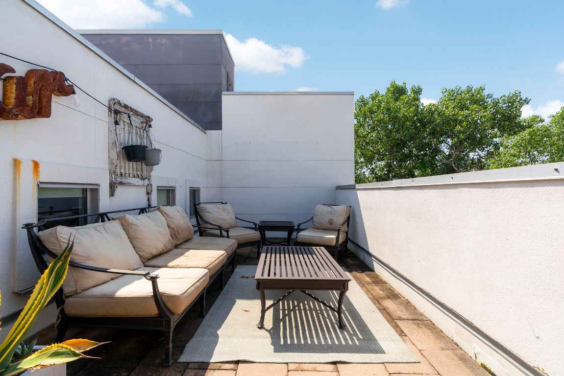 a view of balcony with furniture