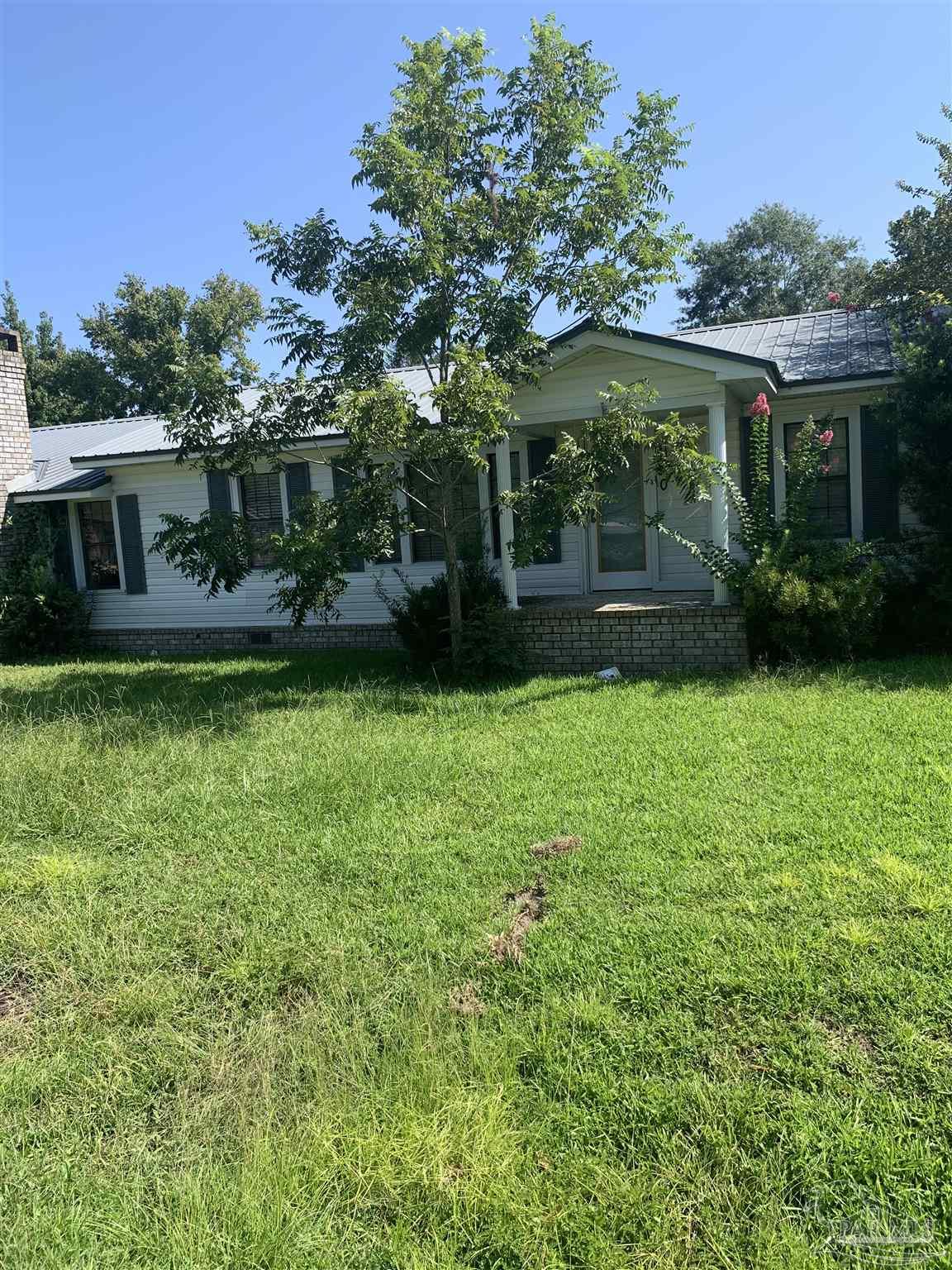 a view of a house with a garden