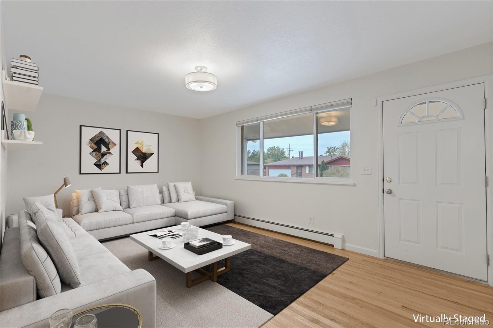 a living room with furniture and a window