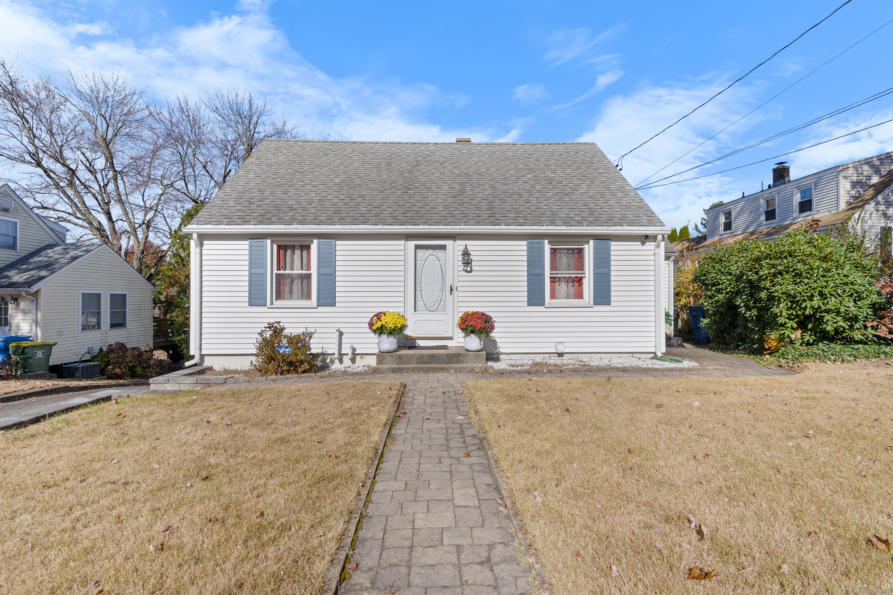 a front view of a house with a yard