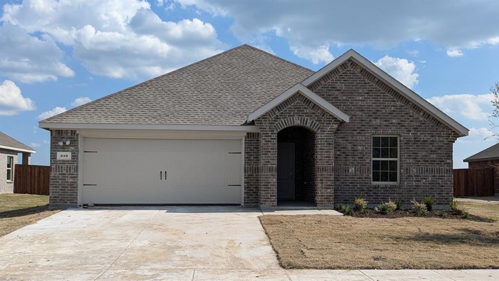 a front view of a house with yard