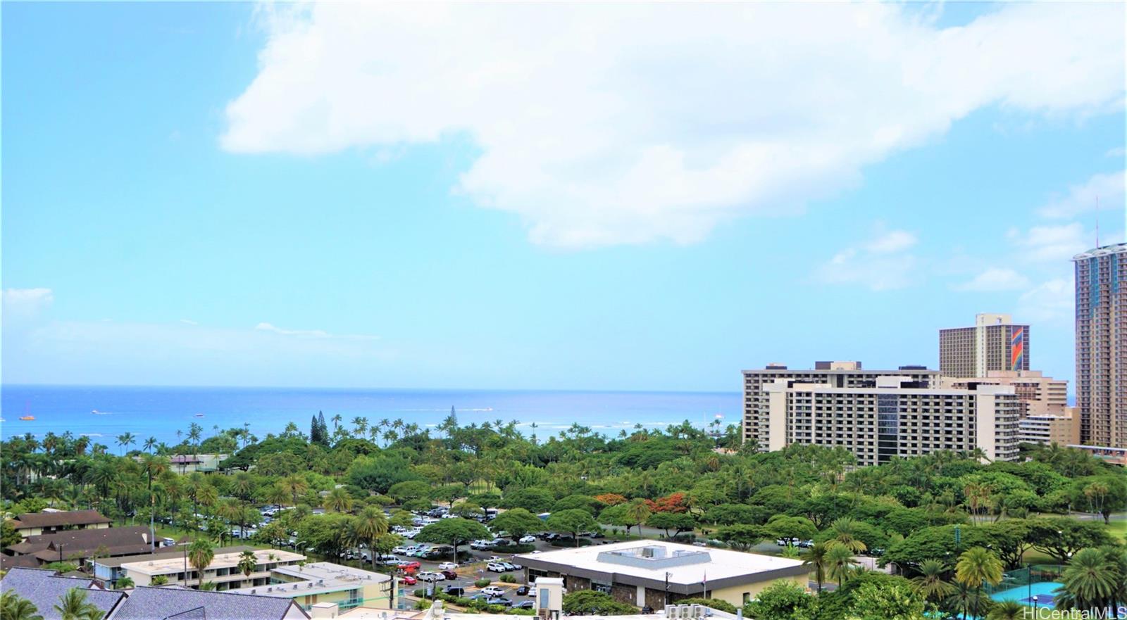 a view of a city with tall buildings in the background