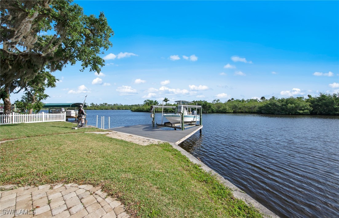 a view of a lake with a yard