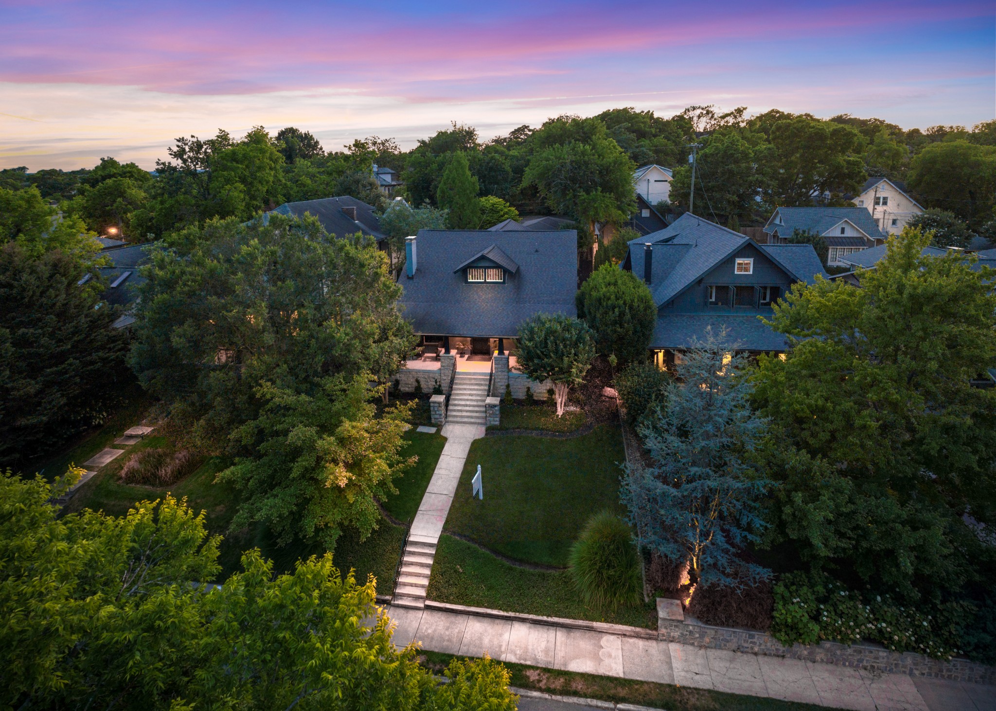 an aerial view of a house with a garden