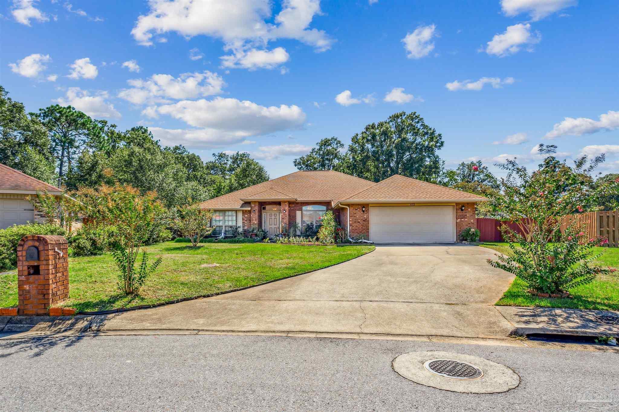 a view of a house with a yard and street view