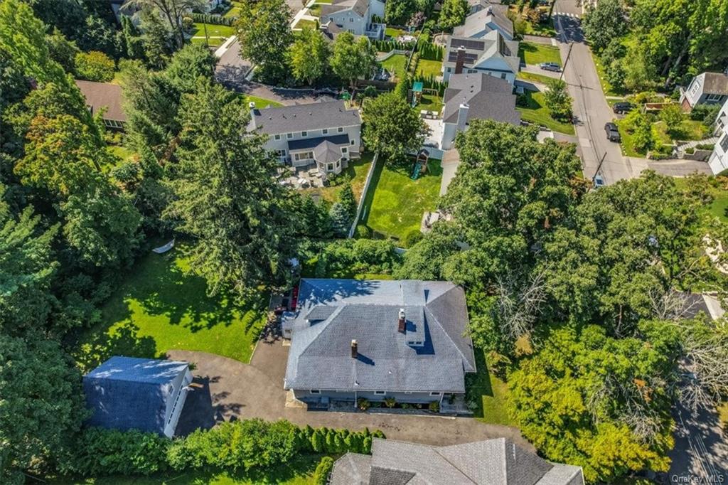 an aerial view of a house with a garden