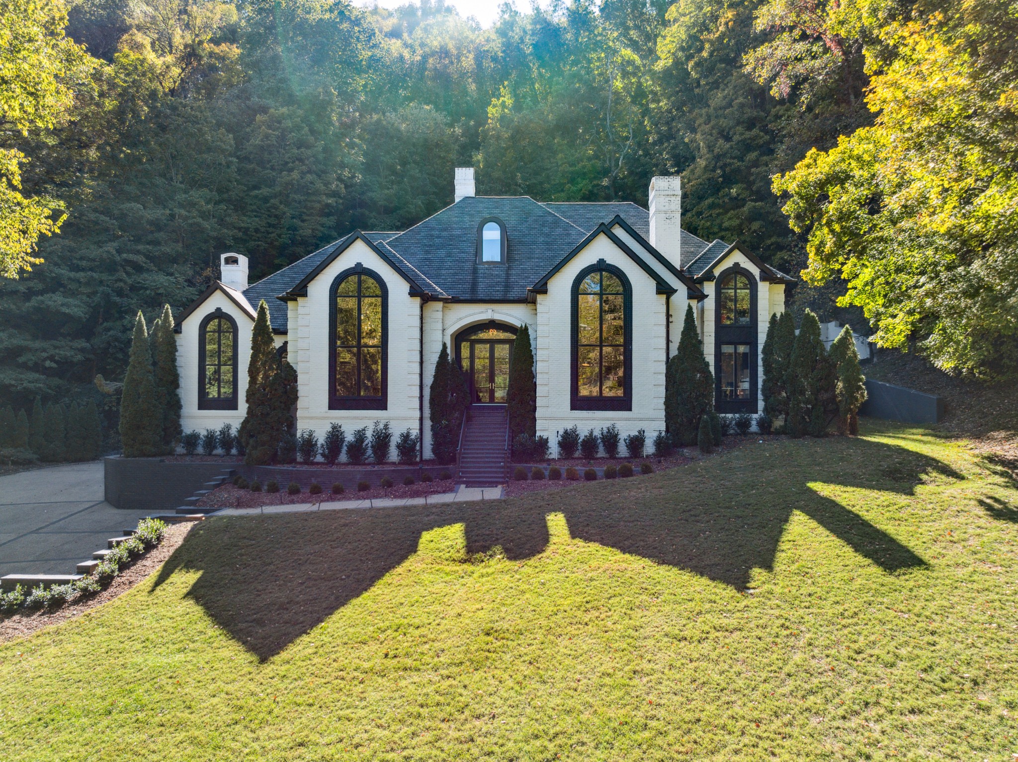 a front view of a house with a yard