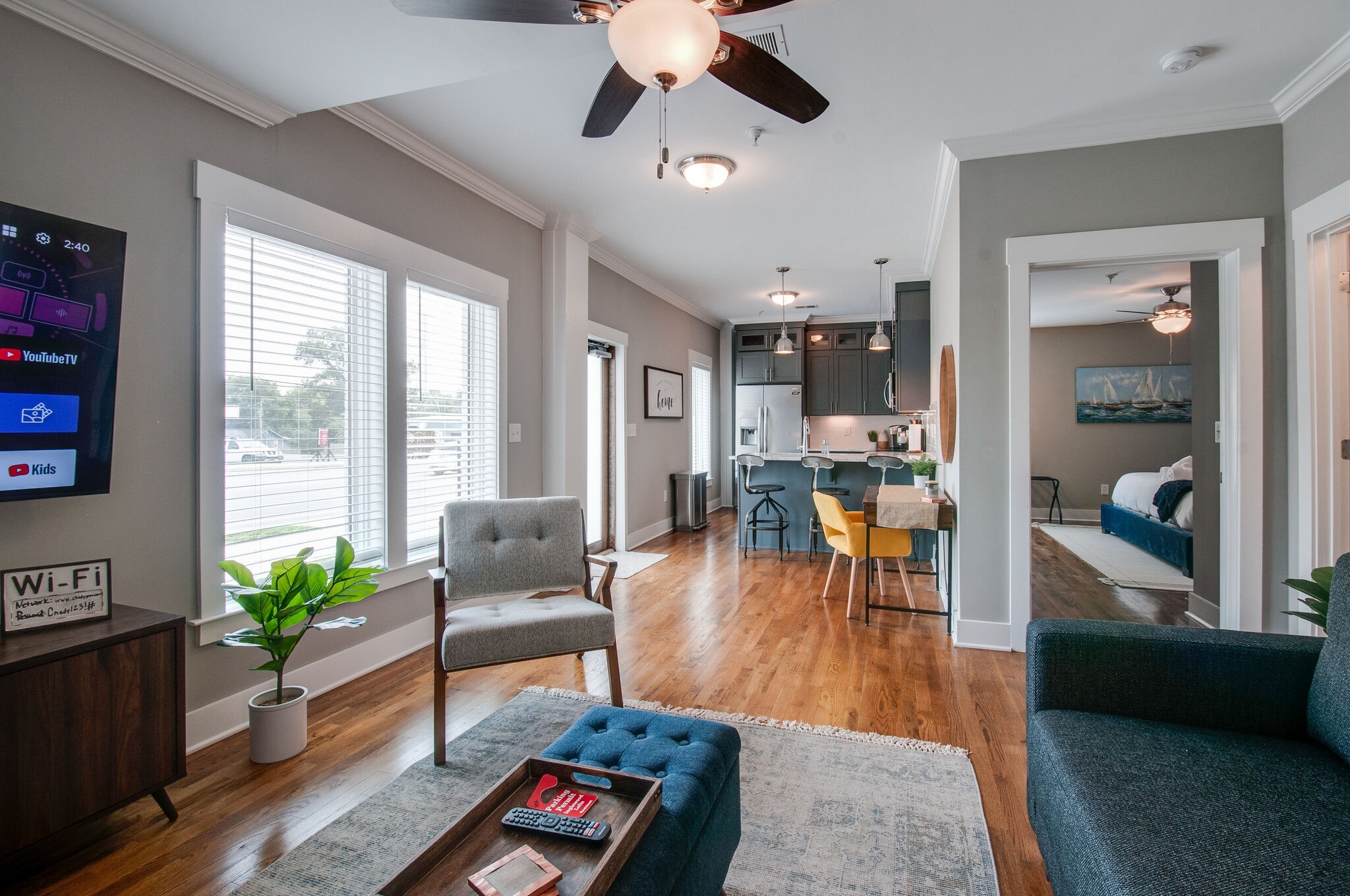 a living room with furniture and wooden floor