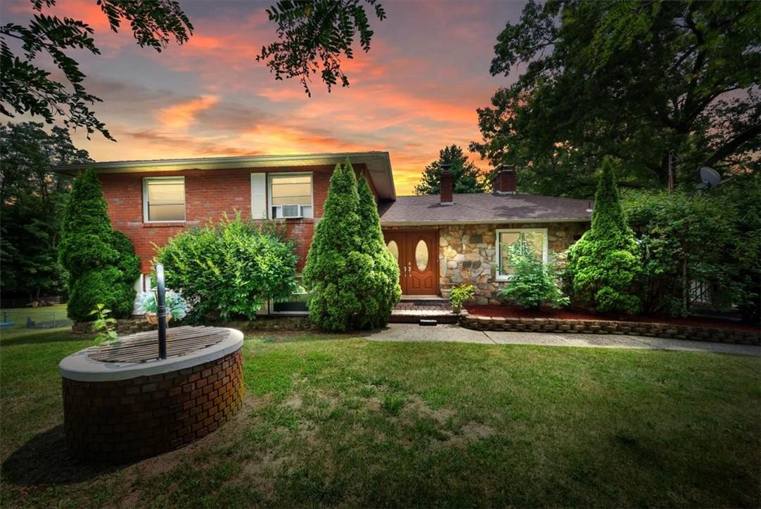 View of front of home with a lawn