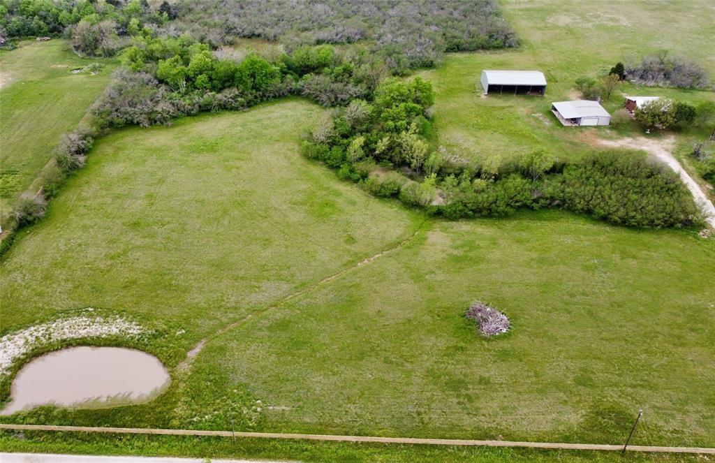 a view of a wooden floor and a yard