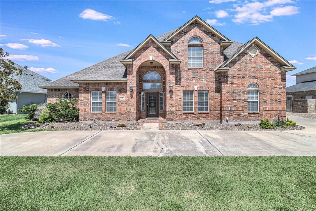 front view of a house with a yard