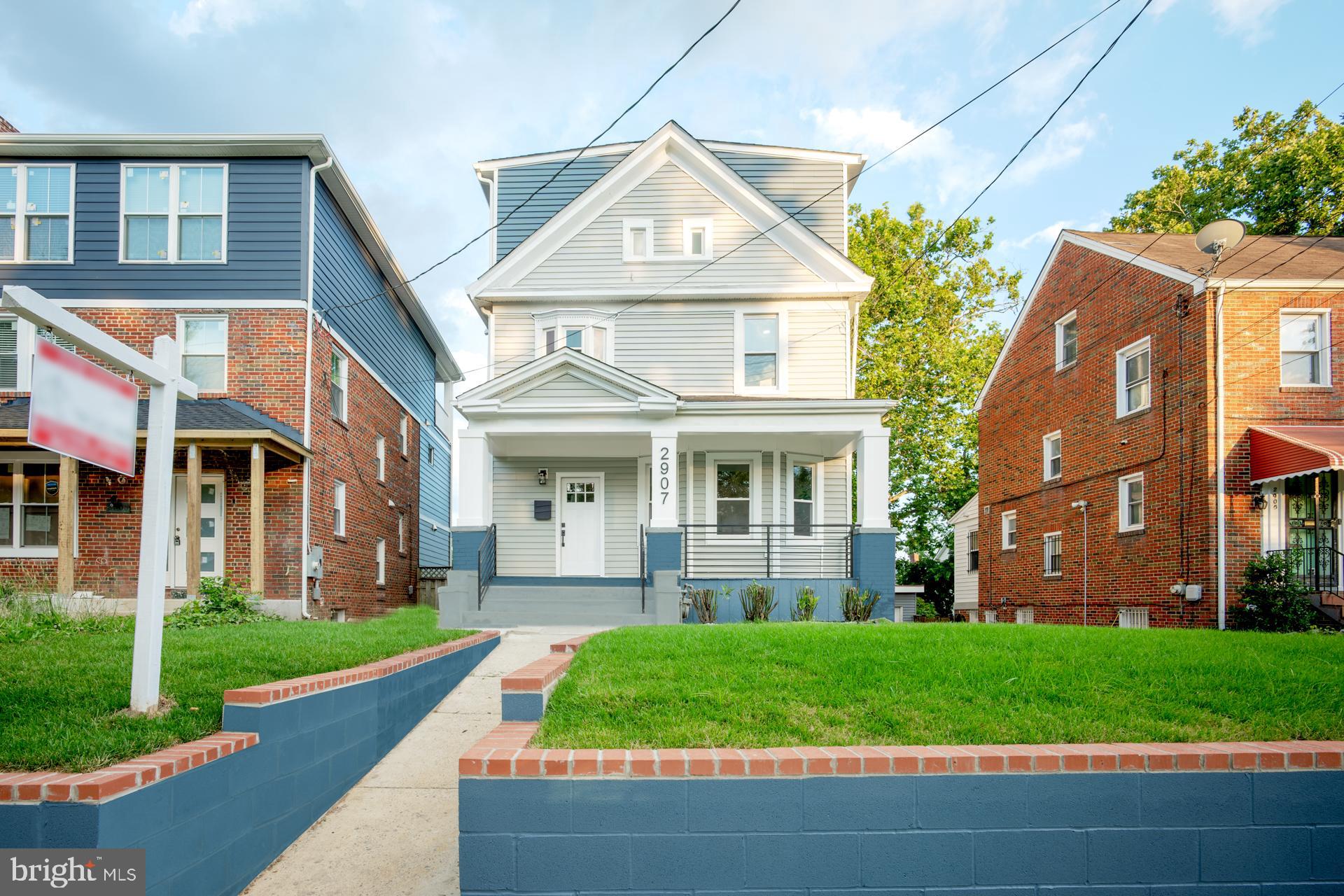 front view of a house with a yard