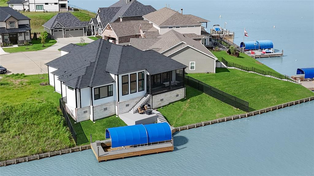 an aerial view of a house with a garden and yard