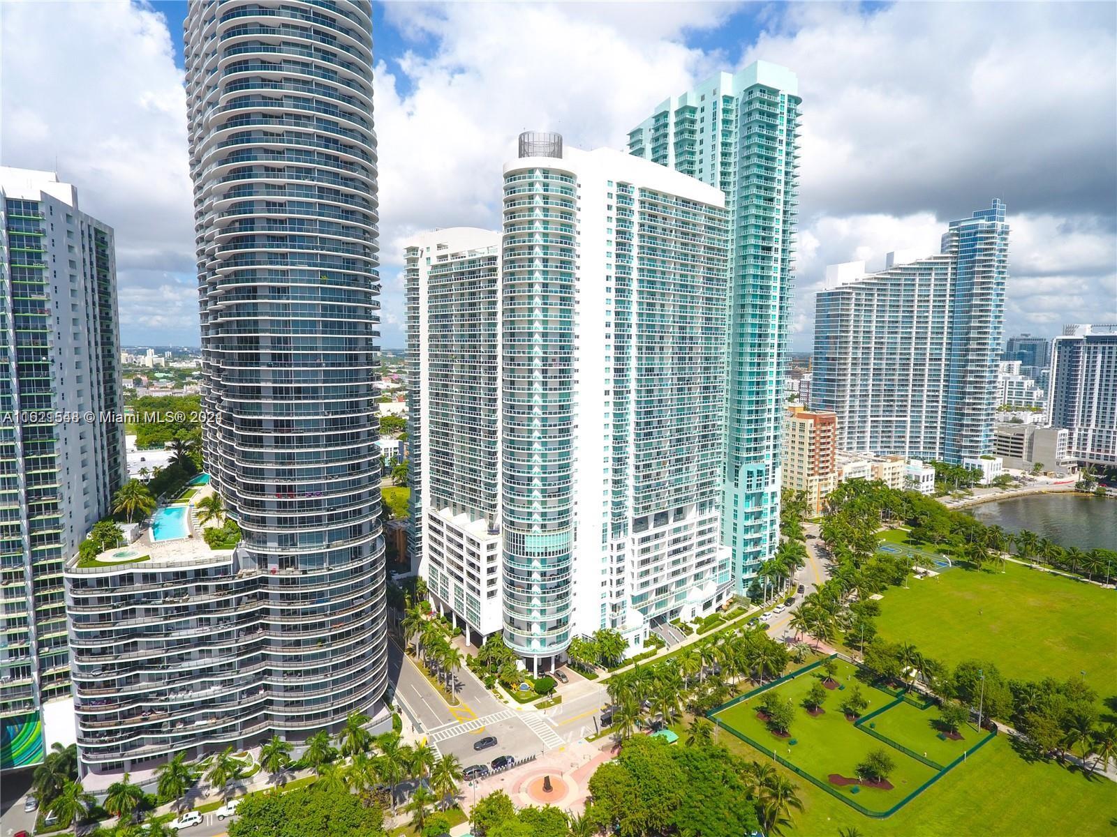 a view of a city with tall buildings