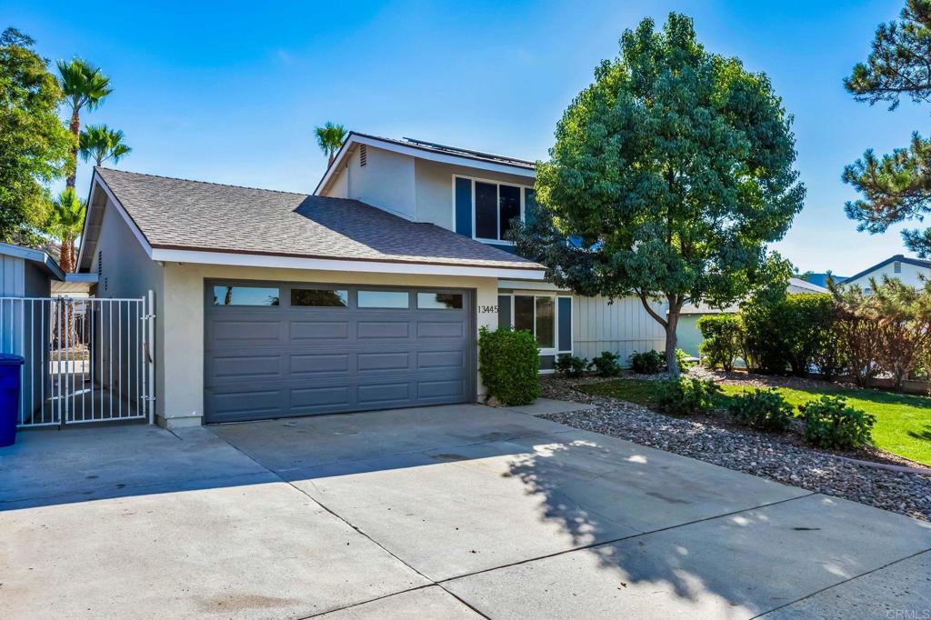 a front view of a house with a garage