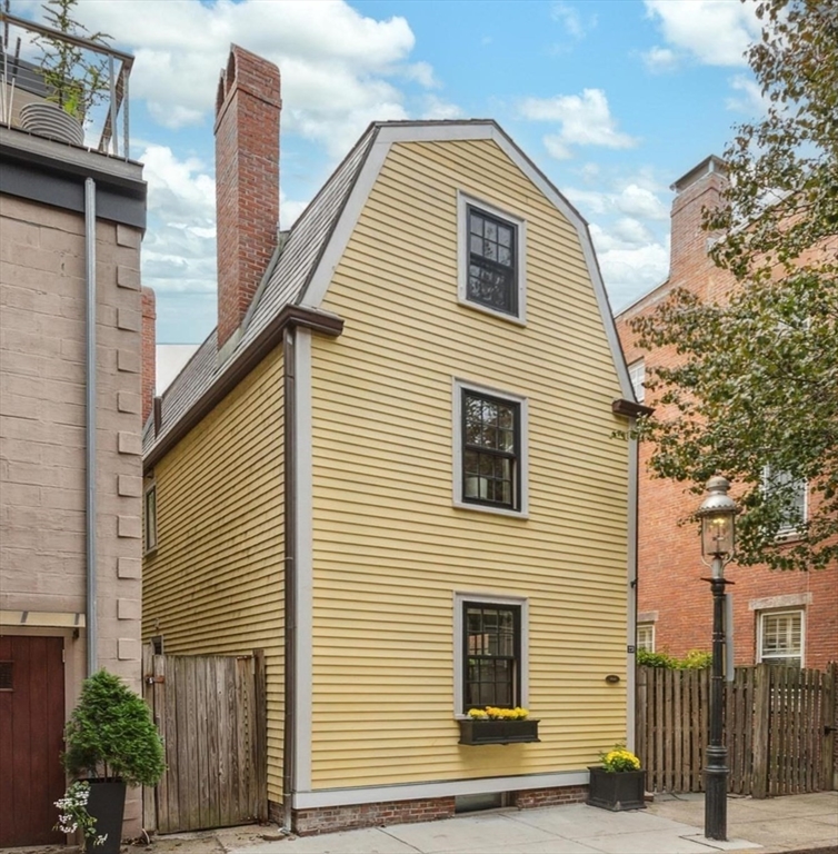 a view of a house with a street