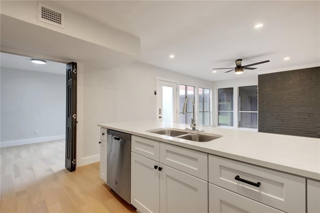 a kitchen with a sink and a window