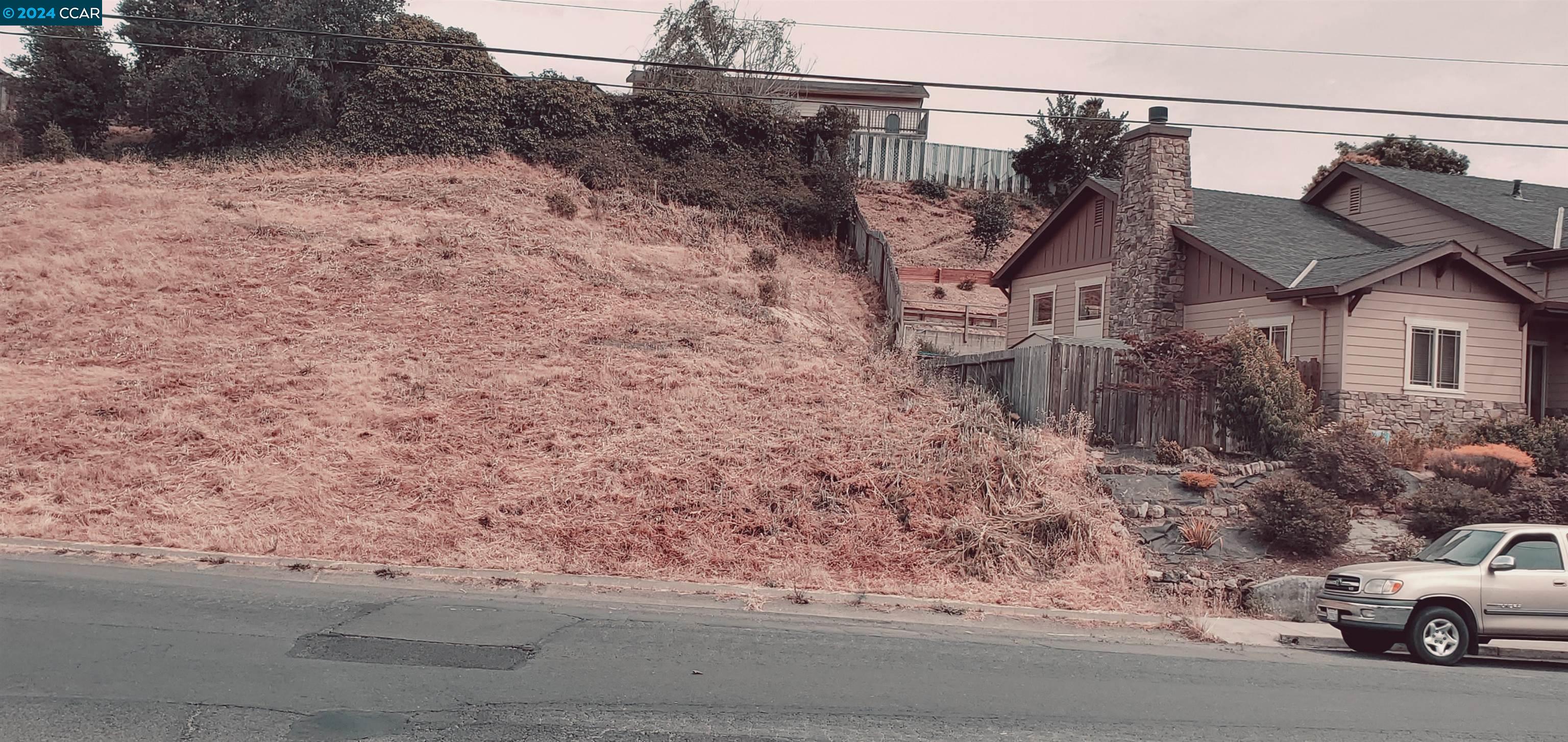 a view of a car parked in front of a house