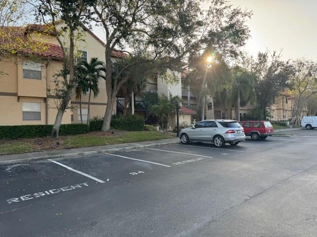 a view of street with parked cars