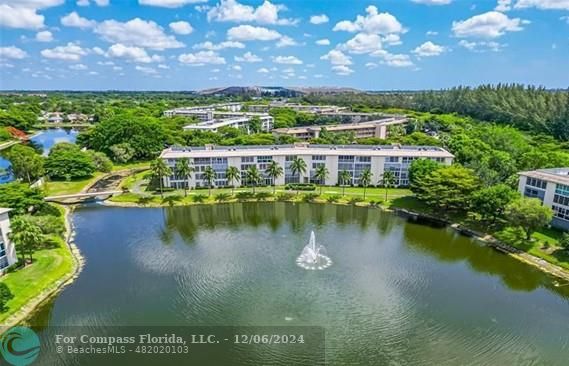 a view of a lake with a yard