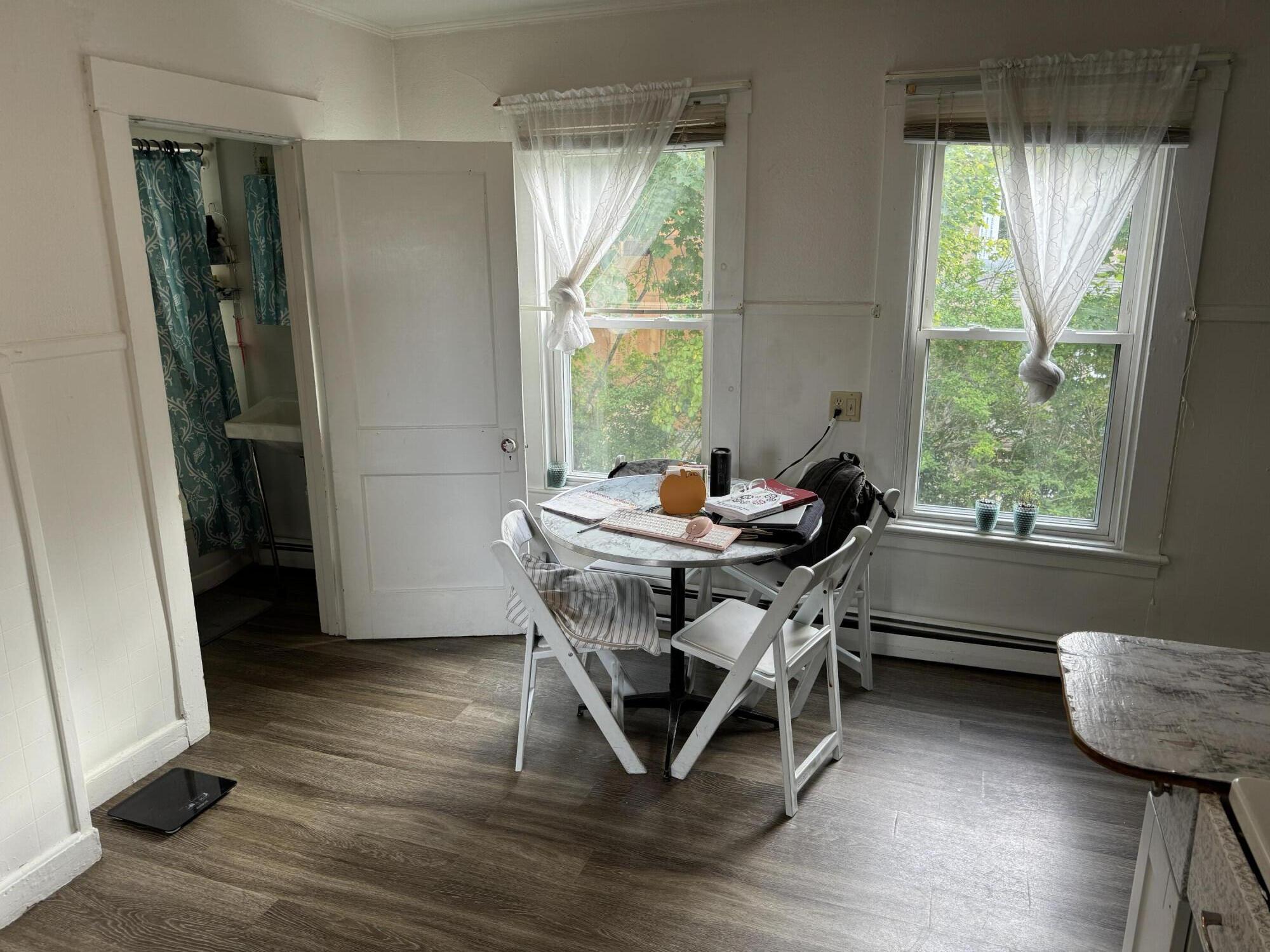 a dining room with furniture window wooden floor