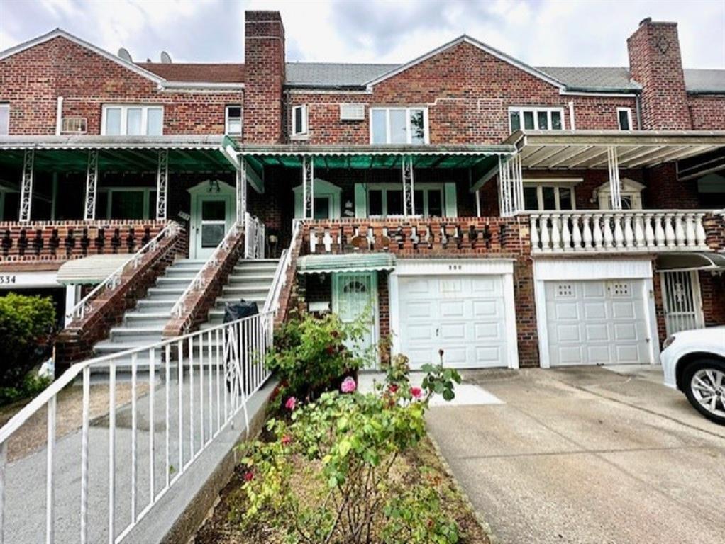 a front view of a building with garden