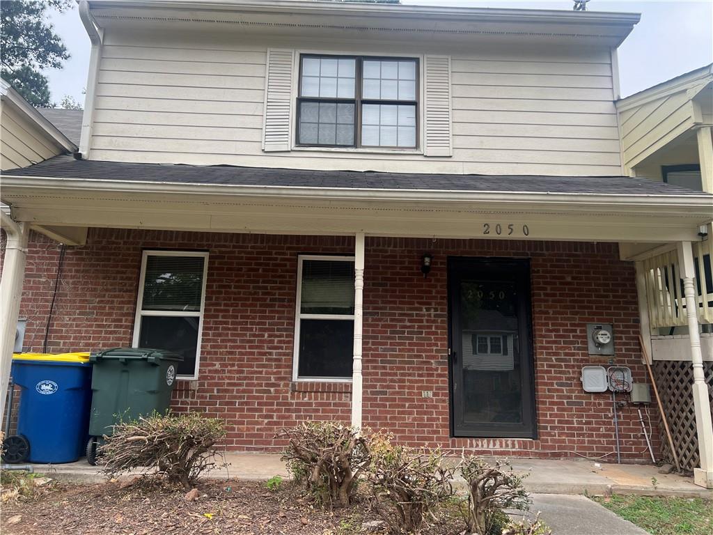 a view of a house with a window and a garage