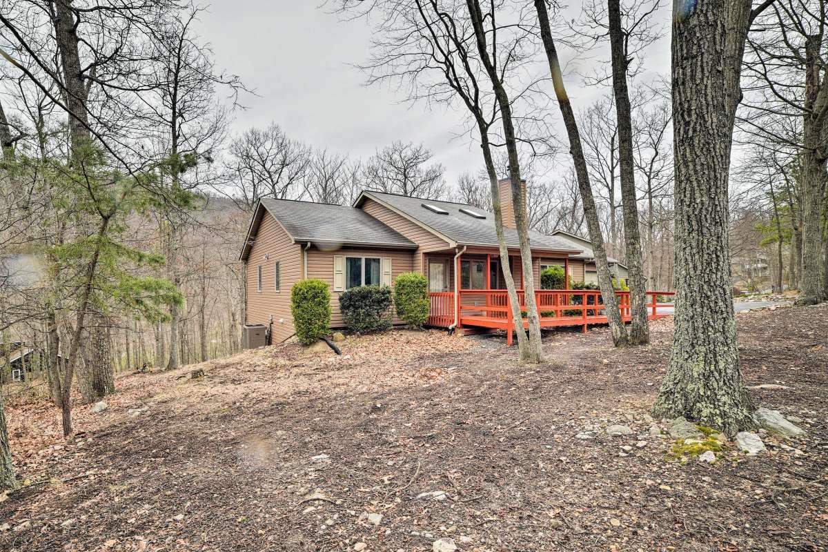 a view of a house with a yard patio and deck