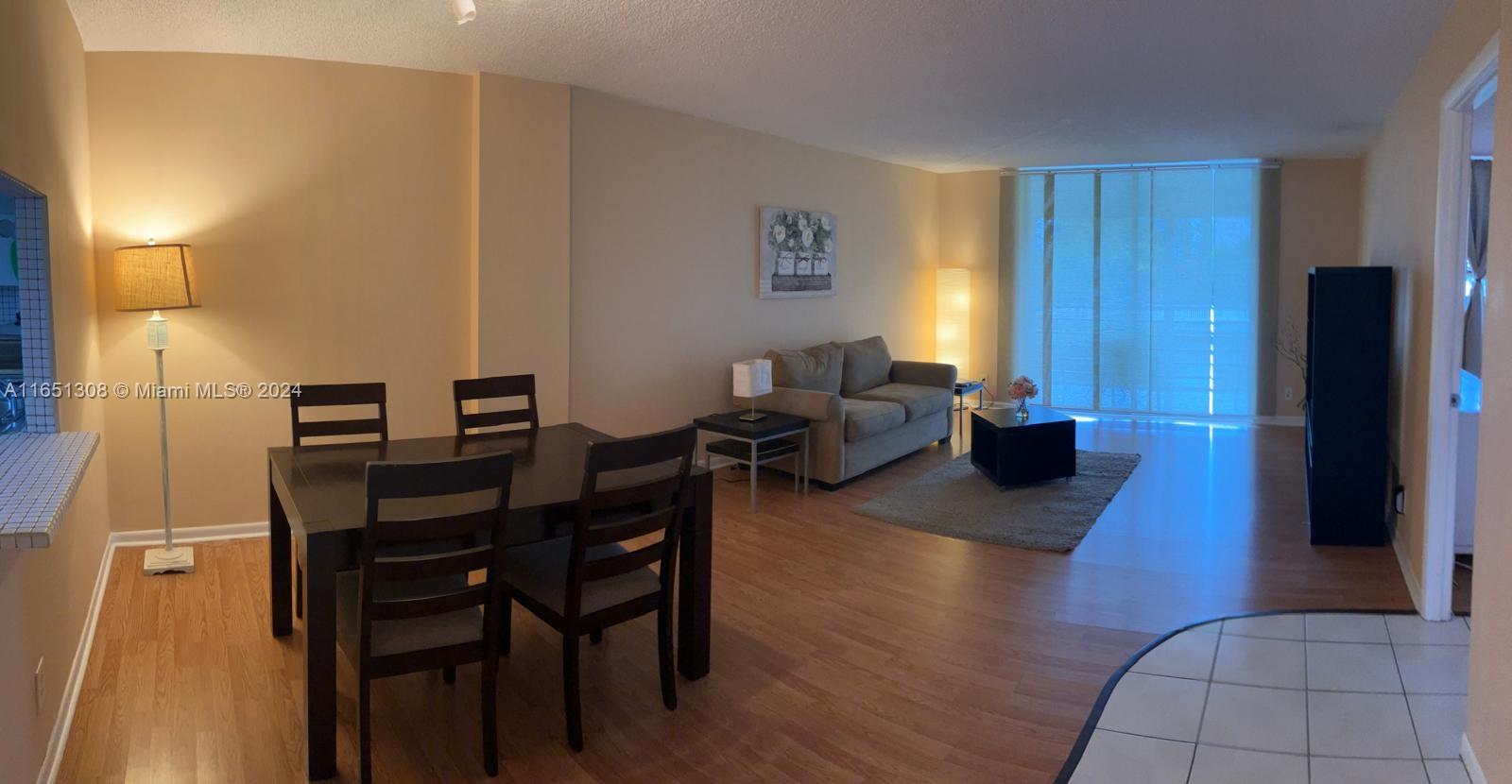 a view of a livingroom with furniture and a couch