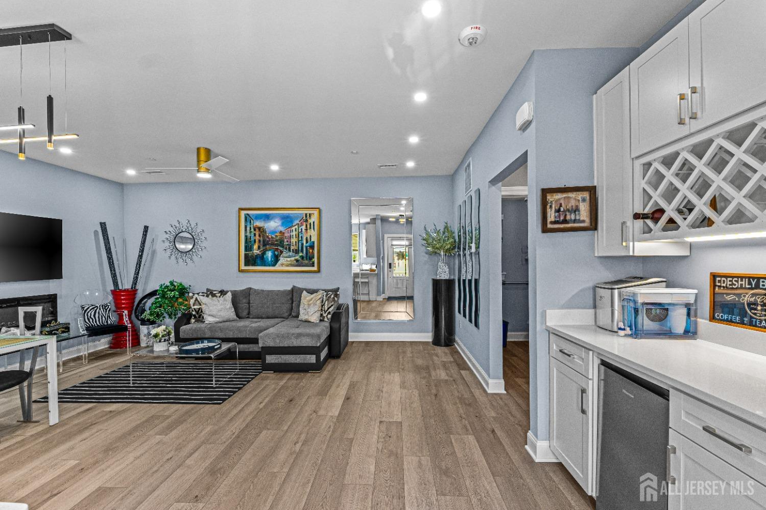 a living room with furniture and a flat screen tv