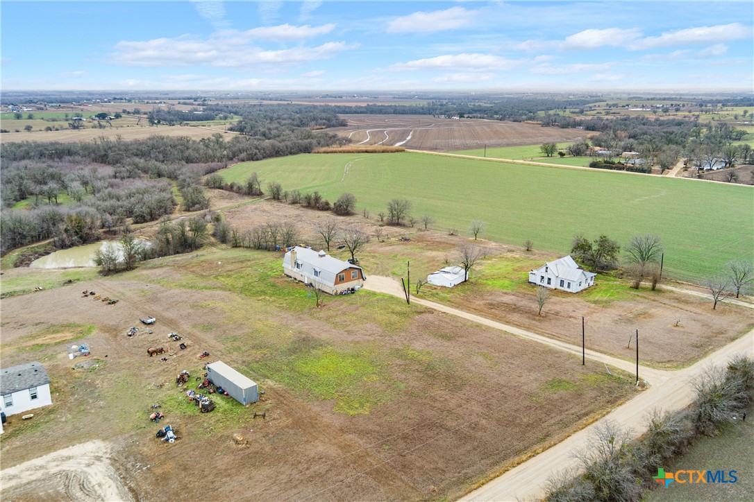 an aerial view of a house with outdoor space