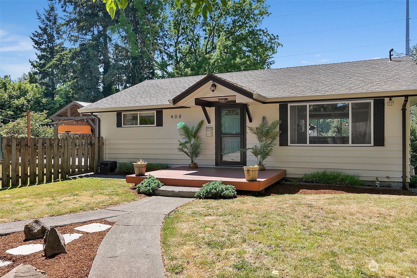 a front view of a house with garden