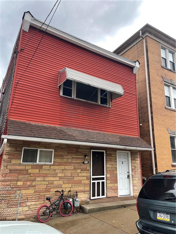 a front view of a house with parking