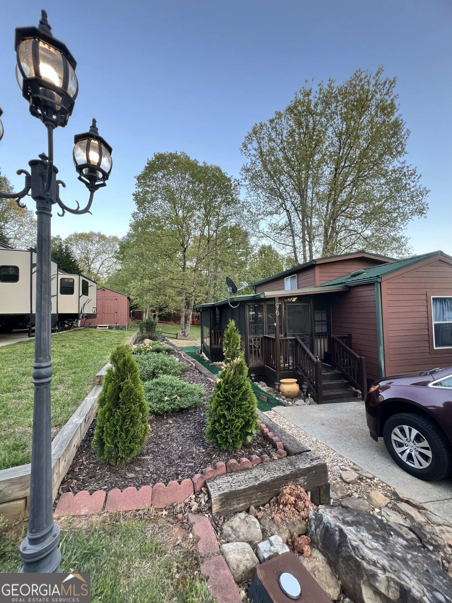 a front view of a house with garden