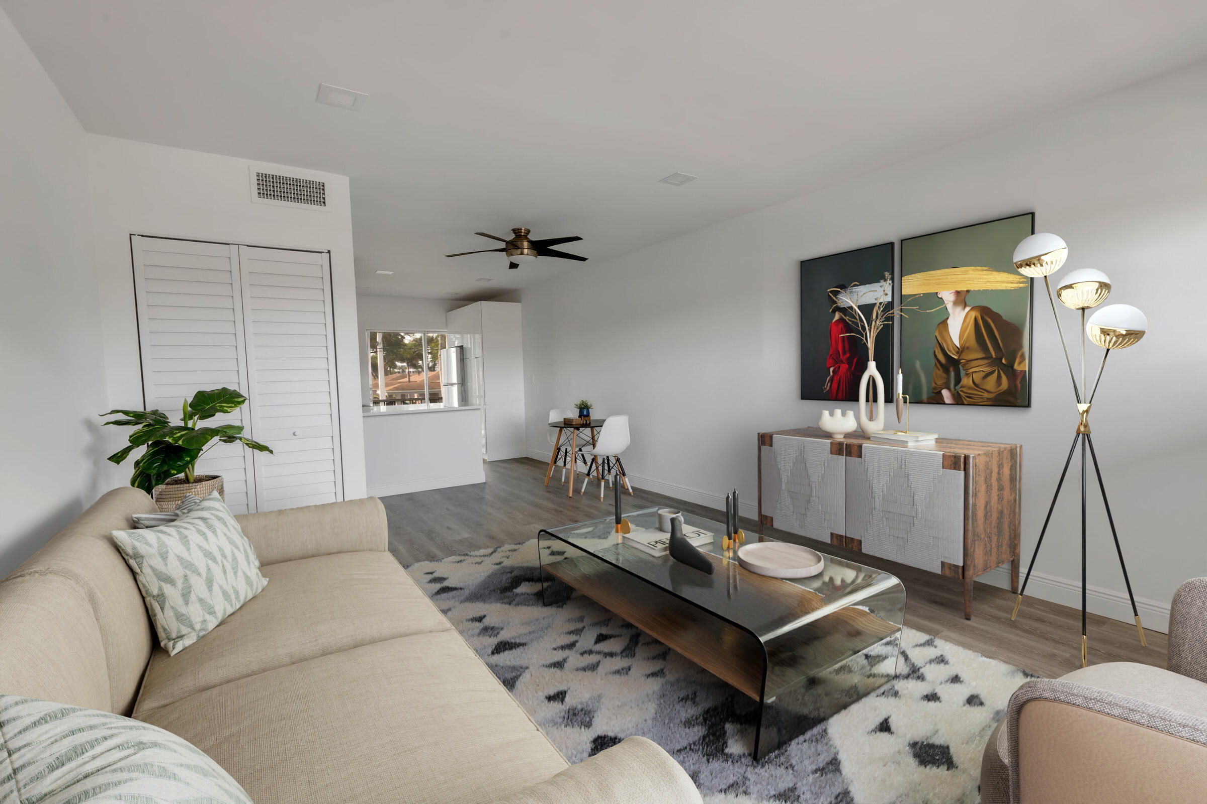 a living room with furniture and wooden floor