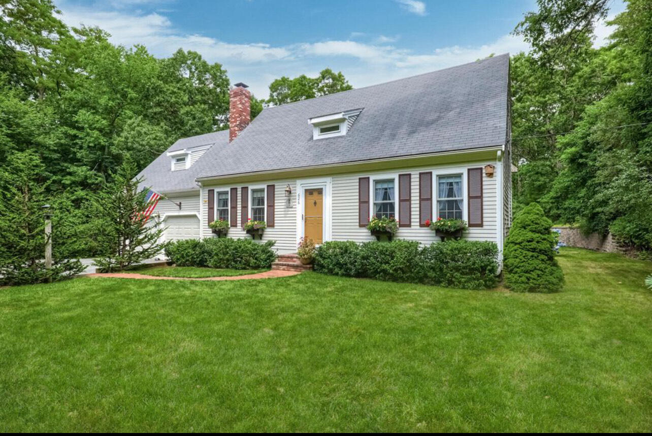 a front view of a house with a yard