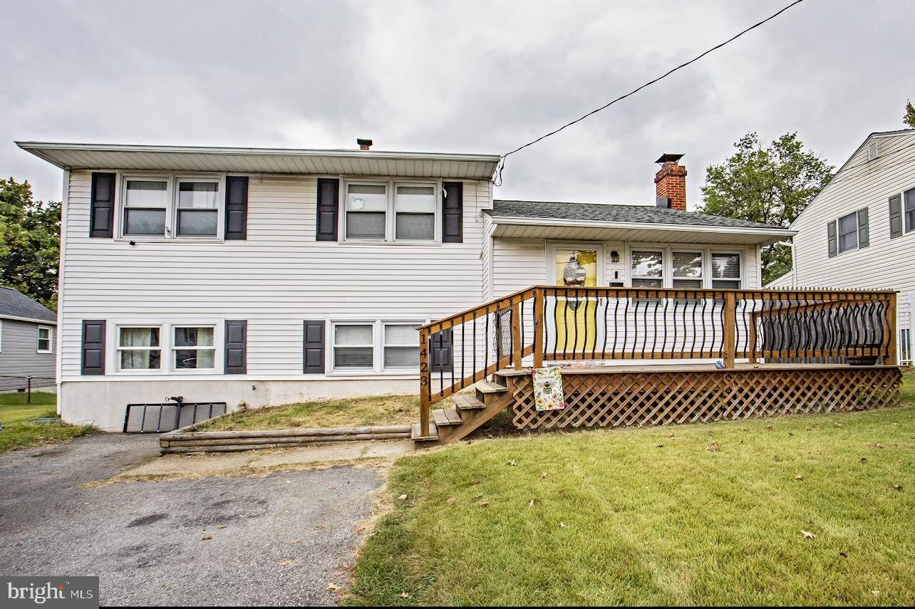 front view of a house with a fence