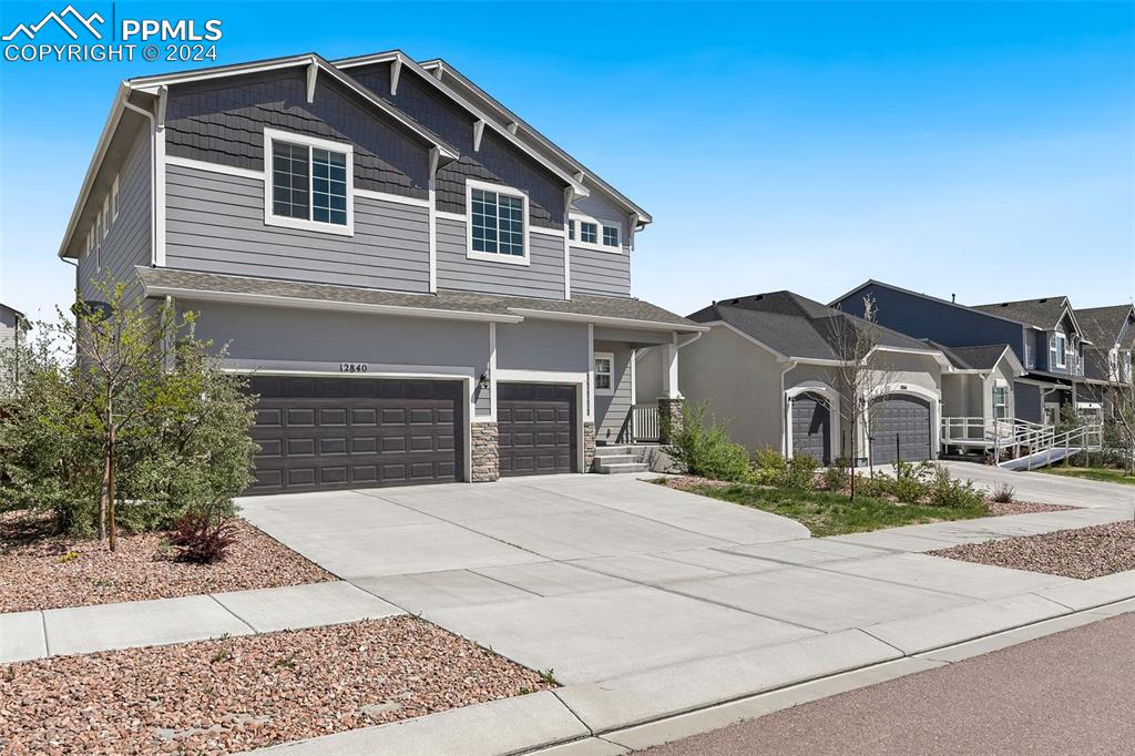 Craftsman inspired home with a garage