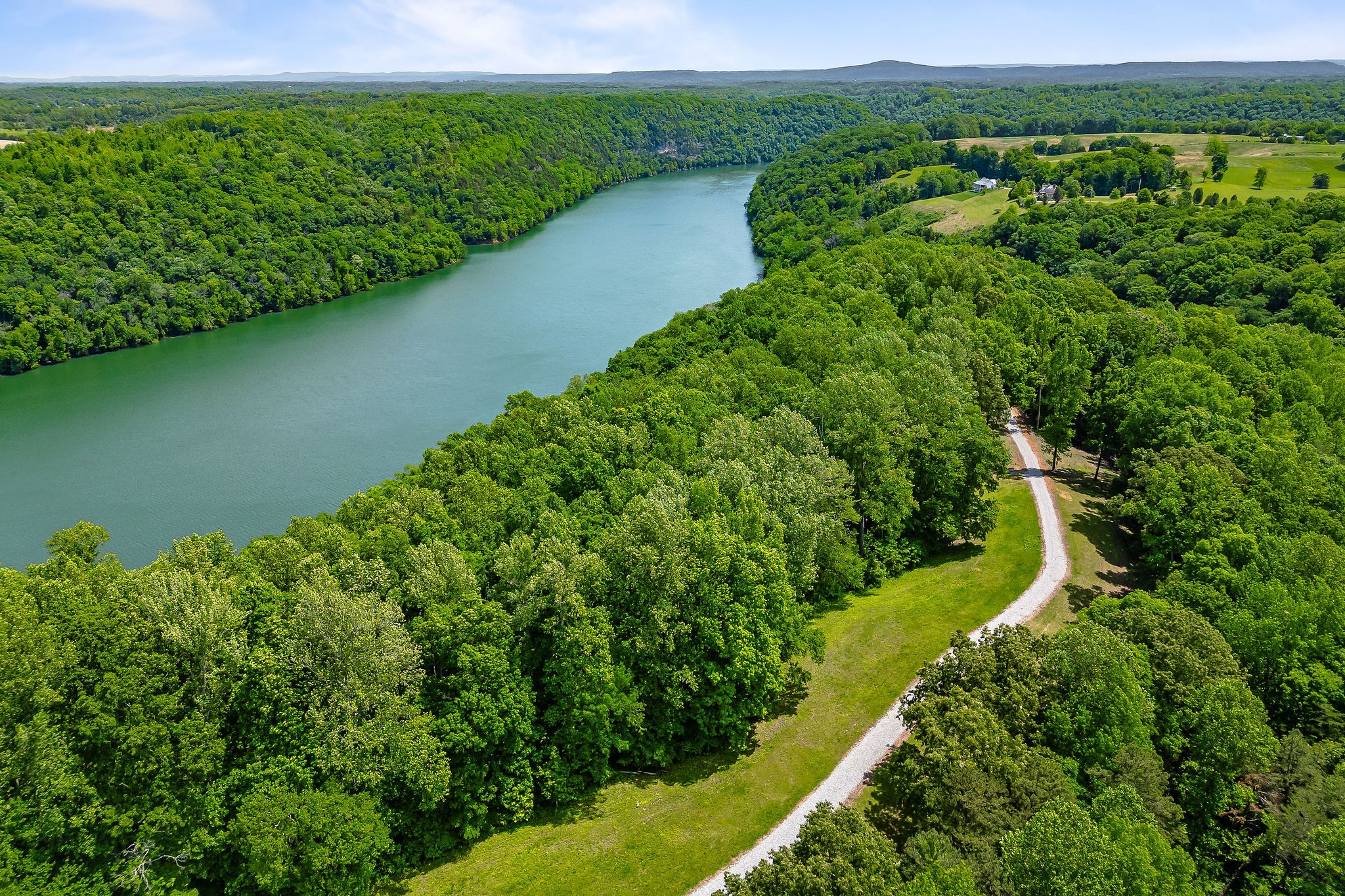 a view of a yard with a lake view