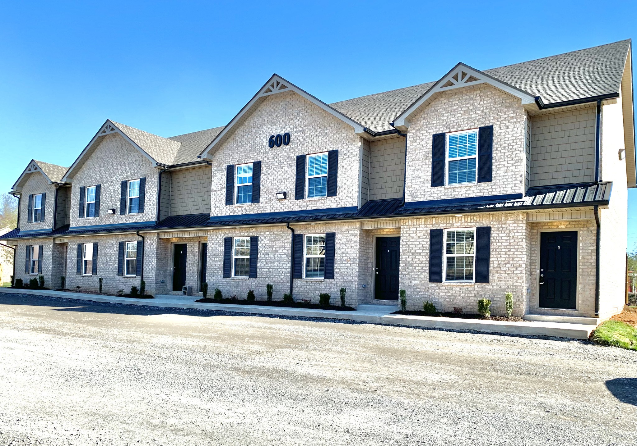 a front view of a house with large windows