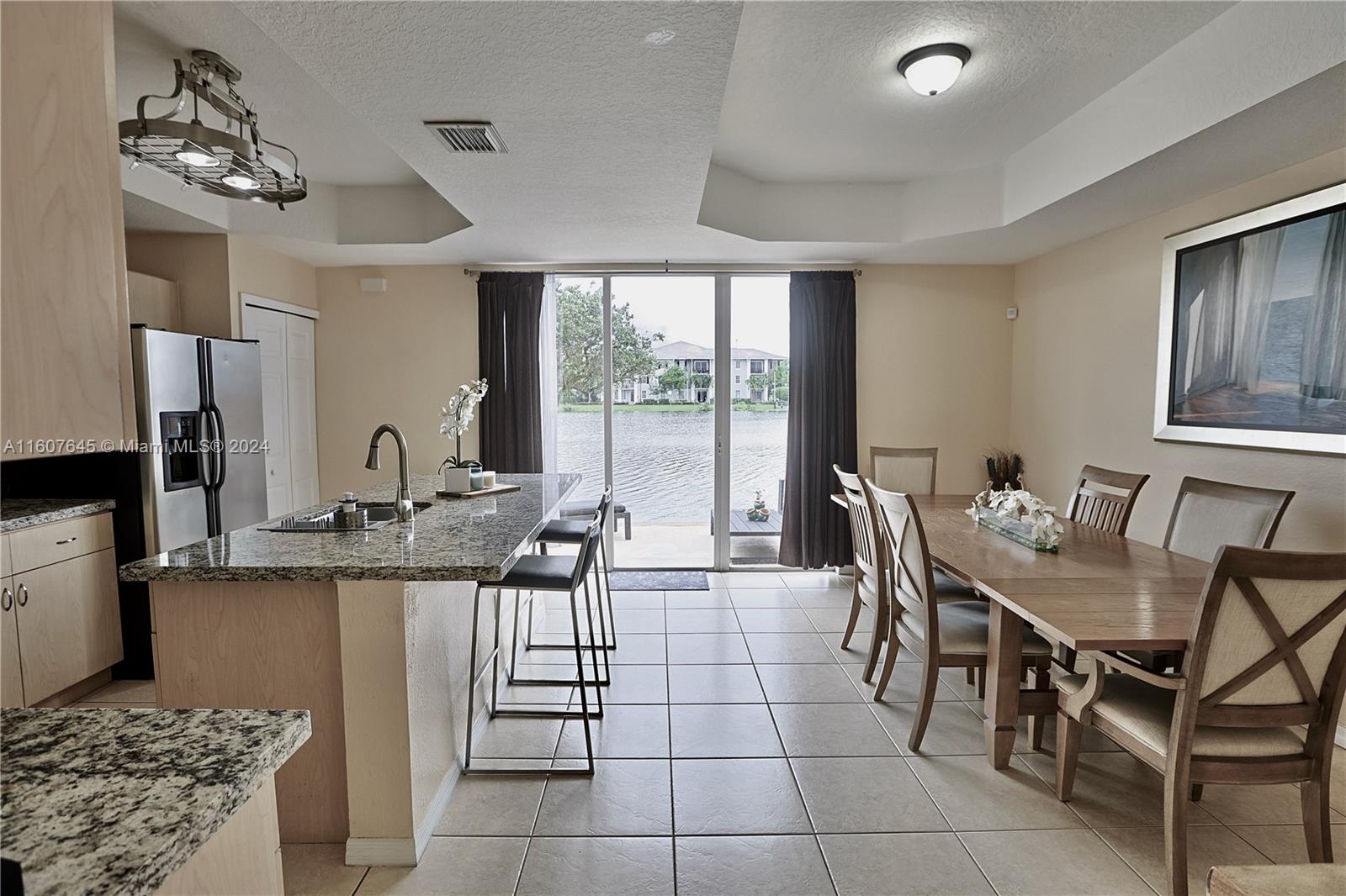 a kitchen with a table and chairs in it