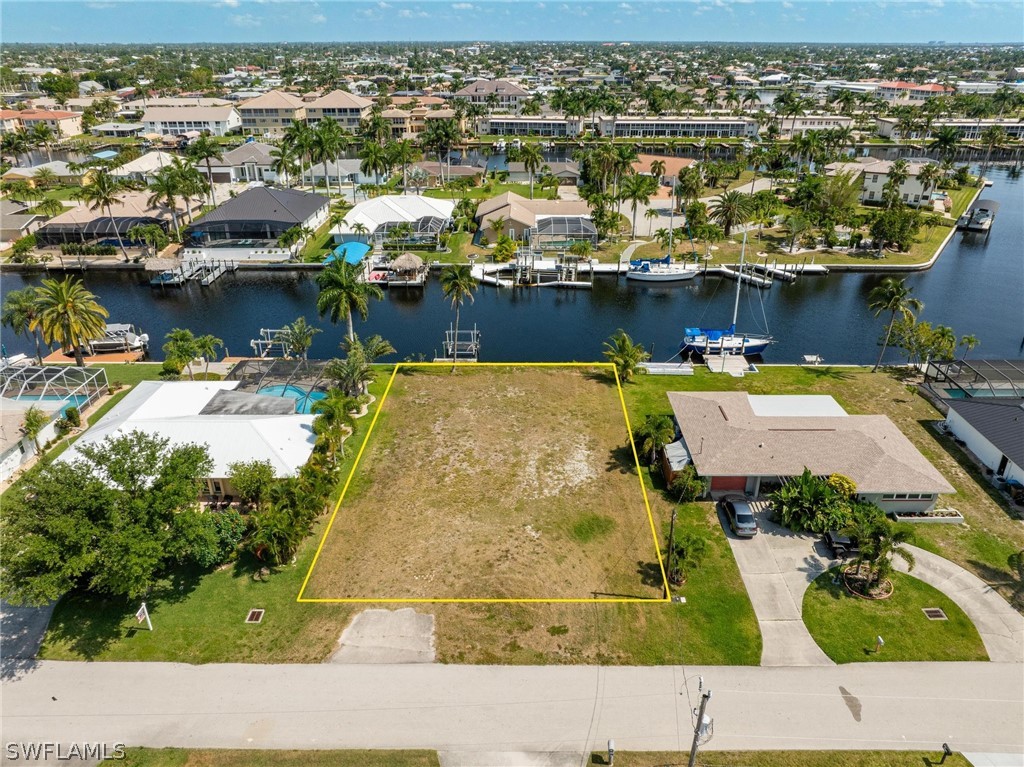 an aerial view of a house with a lake view