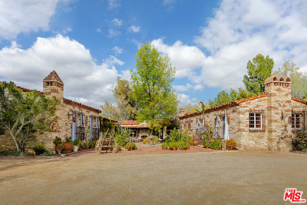 a view of a street with a building in the background